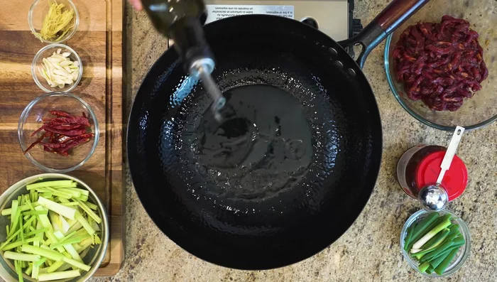 Heat wok over high heat until smoking hot. Add oil, swirl to coat. Add beef strips and pan-fry for 20-30 seconds per side, then stir over medium-high heat for 5 minutes until slightly charred.