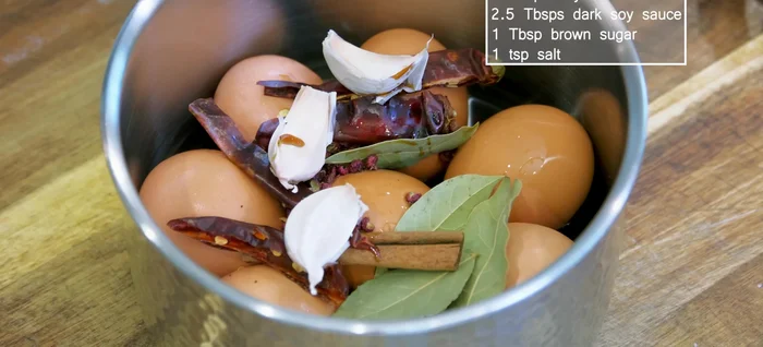 Add soy sauce, dark soy sauce, brown sugar, and salt to the pot.