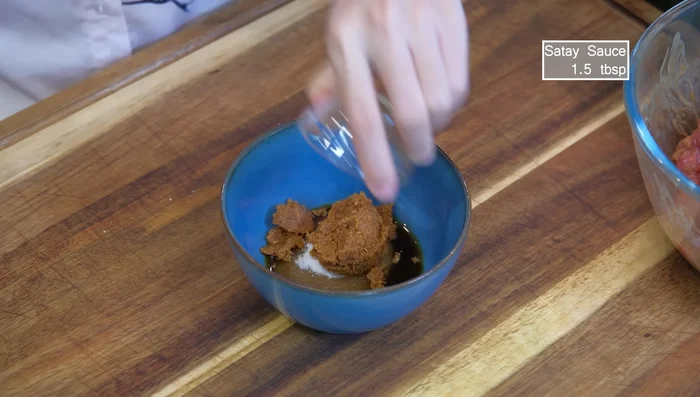 Prepare the sauce: Combine soy sauce, sugar, satay sauce, shrimp paste/anchovy fillets, peanut butter, and curry powder (optional). Mix well.
