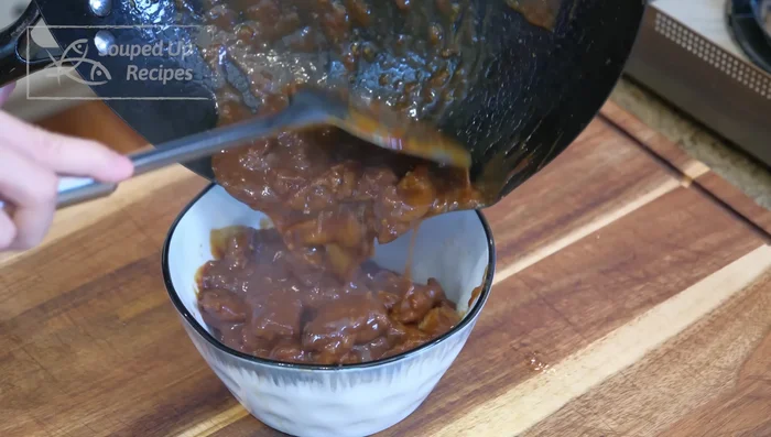 Combine beef and sauce: Return beef to wok, mix well until sauce is thick and creamy.