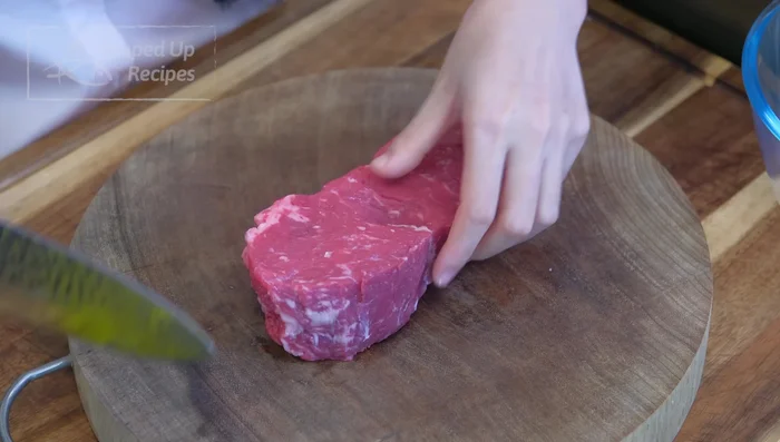 Prepare the beef: Remove silver skin from steak. Cut into 1/8 inch thick slices. Marinate with ginger juice, white pepper, soy sauce, dark soy sauce, cooking wine, potato starch/cornstarch, and egg white. Add a drizzle of oil to coat.