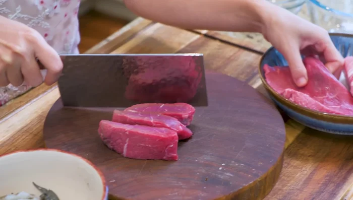 Cut beef, pork, and tilapia into bite-sized pieces; grind tilapia.