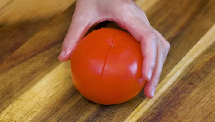 Cut a cross in a tomato and place in the center of the rice.
