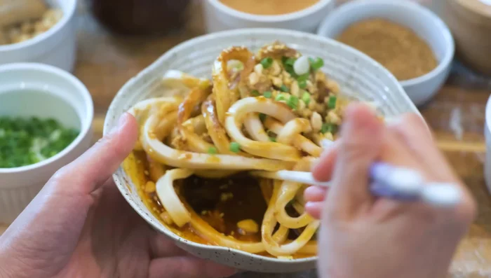 Toss the cooked noodles with the sauce and serve.
