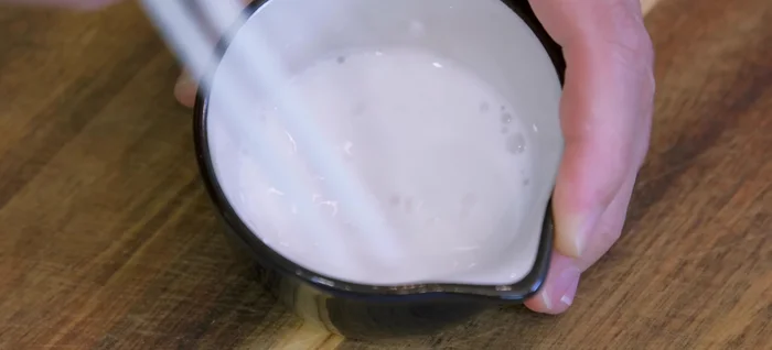 Thicken the sauce with a slurry of tapioca starch and water. (333.319)