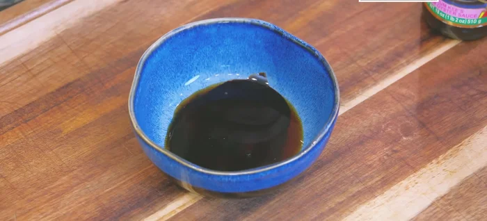 In a bowl, mix soy sauce, dark soy sauce, oyster sauce, jewo paste, tomato paste, sugar, and red fermented bean curd.