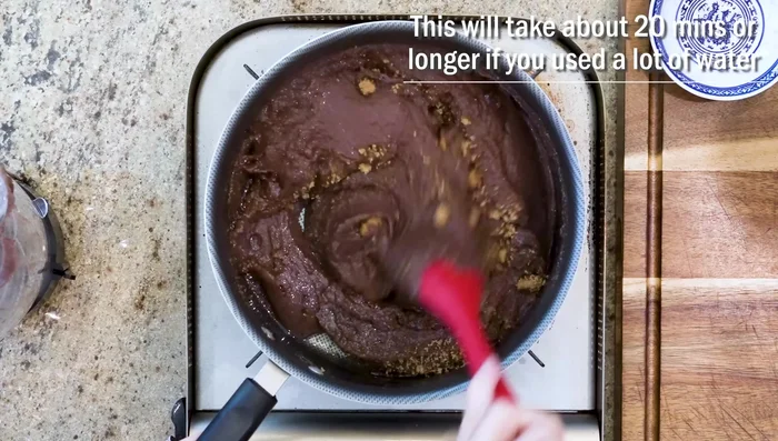 Stir constantly over medium-high heat initially (to prevent bubbling), then reduce heat to low as the mixture thickens. This will take about 20 minutes or longer, depending on water content.