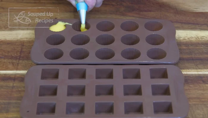 Pipe 7 grams of lava filling into each silicone mold. Freeze overnight.