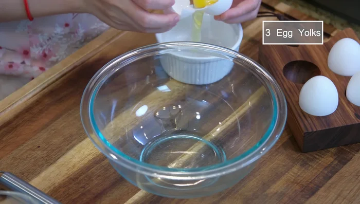 Prepare the custard filling: Combine egg yolks, sugar, milk, melted butter, cake flour, and milk powder. Stir until smooth. Add red food coloring (optional).