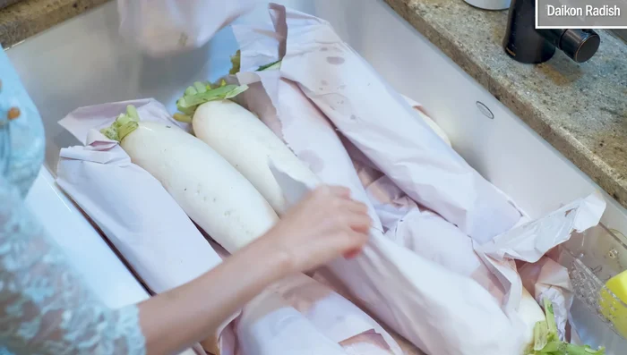 Wash the daikon radish thoroughly with a soft sponge. No need to peel.