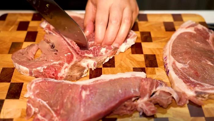 Prepare the beef: Remove the bone from the T-bone steak and cut it into strips.