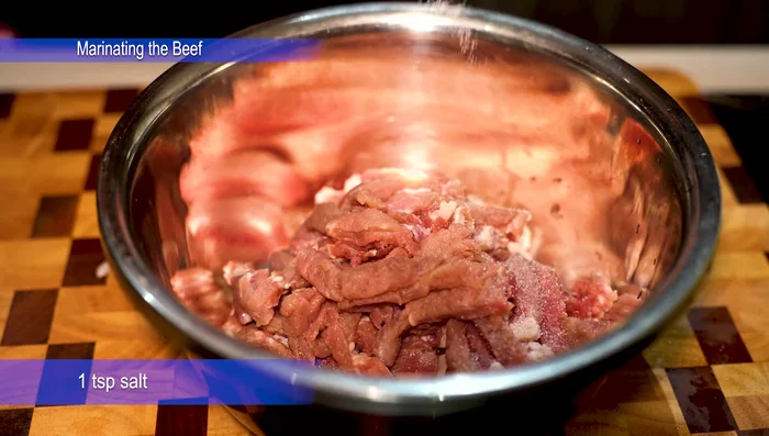 Marinate the beef: In a bowl, combine beef strips with salt, white pepper, crushed garlic and ginger, soy sauce, oyster sauce, sesame oil, and corn starch. Mix well and refrigerate for 1-2 hours.