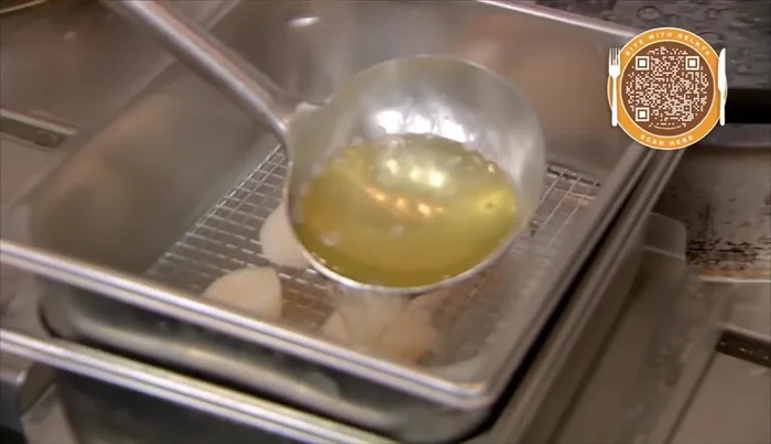 Immediately place the pan over ice, then refrigerate the scallops to cool.