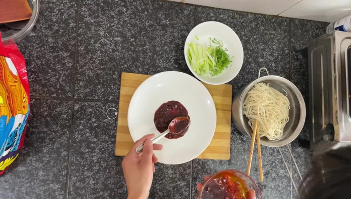 To plate: Spread the chilli garlic sauce in a circle on a plate. Place noodles in the center. Optionally, you can toss the noodles in butter before plating.
