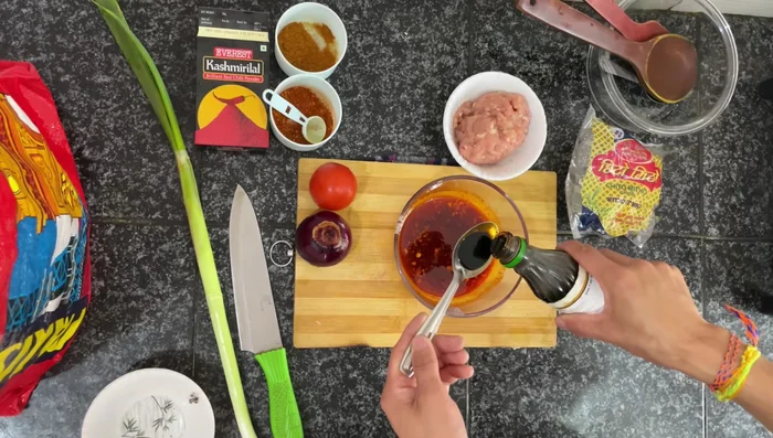 Add 1 tablespoon of soy sauce to the chilli garlic oil mixture and mix well. This is your base sauce.