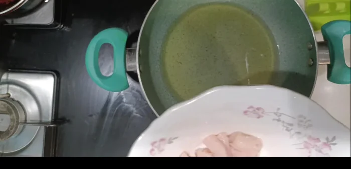 Heat enough oil in a karai to fry the chicken. Fry chicken in batches, cooking both sides on very low flame until cooked through. Keep aside.
