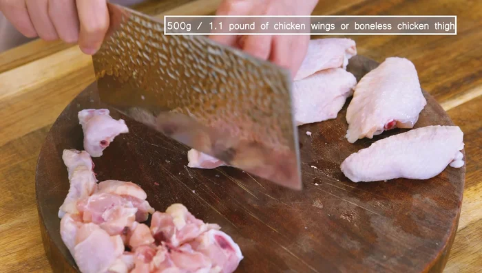 Chop chicken wings into bite-sized pieces. If using boneless thighs, cut into similar sized pieces.