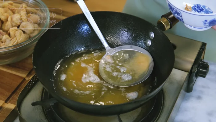 Remove crumbs from oil. Increase oil temperature to 400°F. Fry chicken again for 1-2 minutes until golden brown.