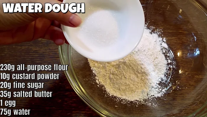 Prepare the water dough: Mix all-purpose flour, custard powder, sugar, room temperature salted butter, one egg, and water to form a dough. Knead for about 5 minutes until smooth.