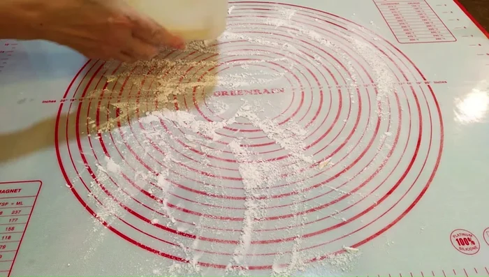 Roll and fold the doughs: On a floured surface, roll the water dough into a 40cm x 25cm rectangle. Place the chilled oil dough on one half, fold the water dough over, and seal. Turn 90° and roll out to 60cm x 30cm. Fold into four layers. Repeat the rolling and folding process twice more, chilling as needed.