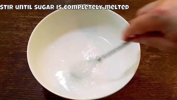 Prepare the filling: Dissolve sugar in hot water. Chill completely. Whisk eggs and add chilled sugar syrup and evaporated milk. Strain the mixture to ensure a smooth texture.
