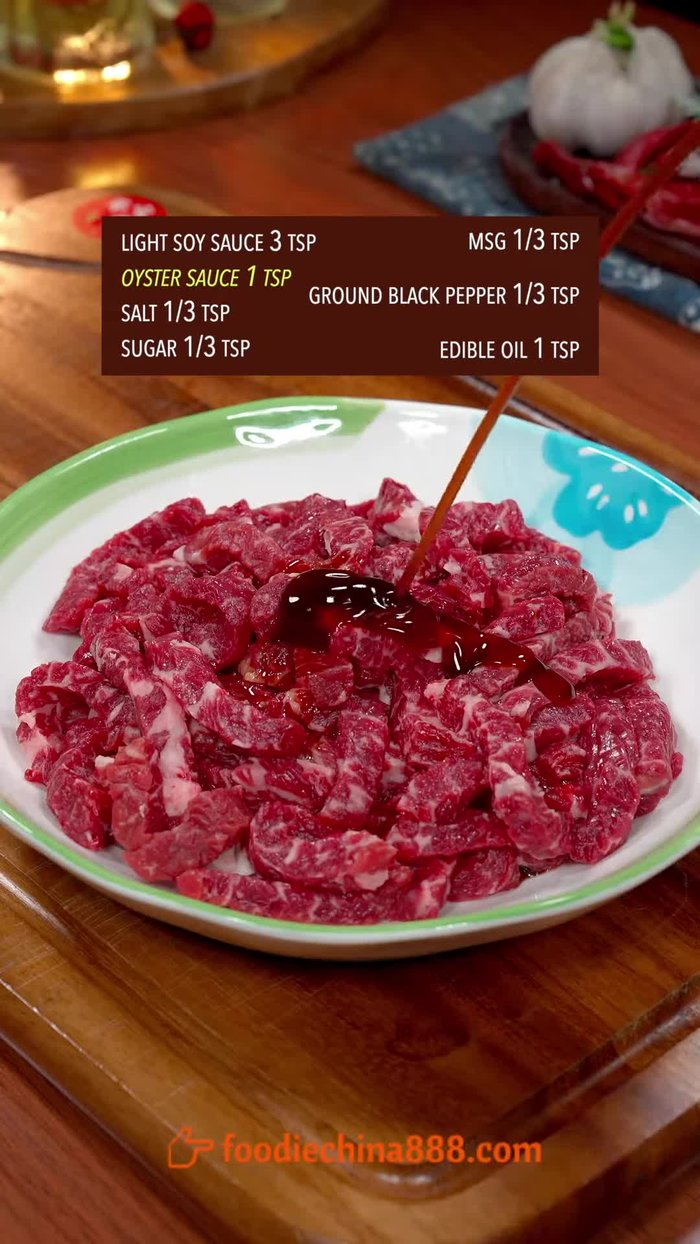 Marinate beef with soy sauce, oyster sauce, legal powder, and edible oil.
