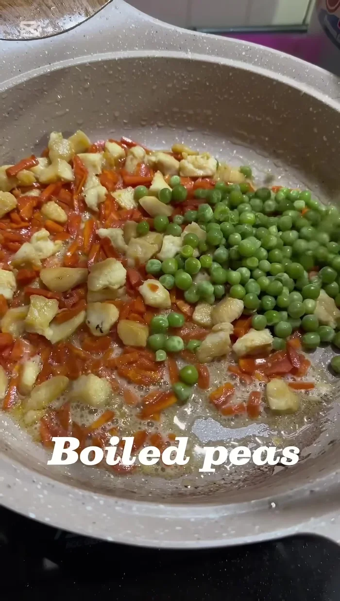 Add boiled peas and capsicum. Add capsicum at the end to avoid overcooking.