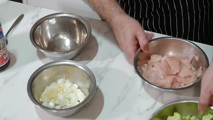 Chop broccoli into florets and thinly slice chicken breasts. Mince garlic and optionally, chop onion.