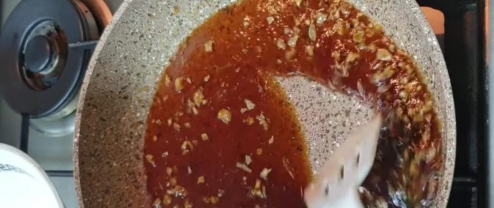 Add the blanched water spinach to the pan and toss to coat with the sauce.