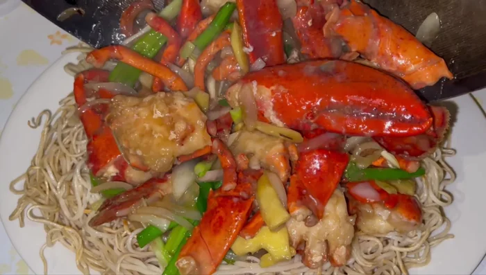 Serve lobster stir-fry over grilled noodles. (1092.6)