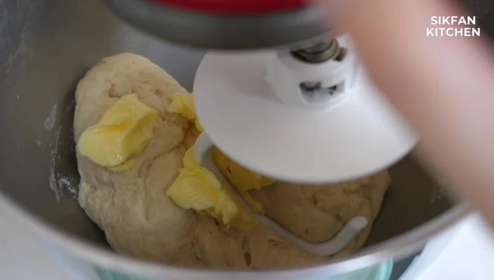 Place the buns on a baking sheet lined with parchment paper. Brush with milk or egg wash and sprinkle with sesame seeds.