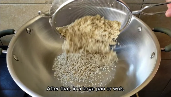 Dry the sesame seeds in a pan over medium-low heat, stirring frequently. Reduce heat to low once they begin to dry. If the pan gets sticky, transfer seeds, wash pan, and continue.