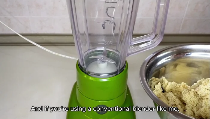 In a blender or food processor, combine the ground sesame seeds, salt, and oil. Blend until smooth and creamy.