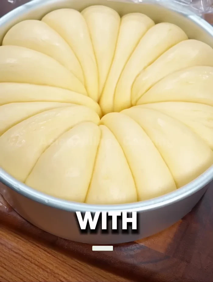 Place the dough balls in an oiled bowl, cover with plastic wrap, and let them rise until doubled in size.