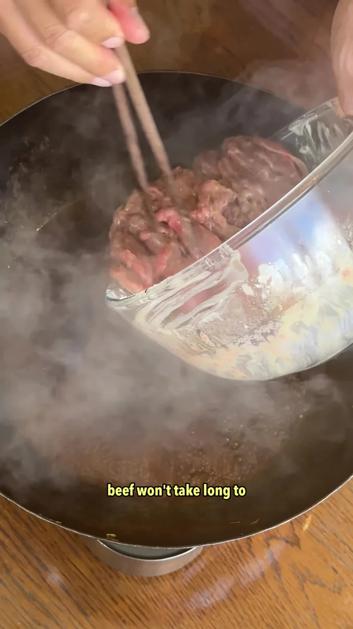 Add the marinated beef and boil for about 30 seconds.