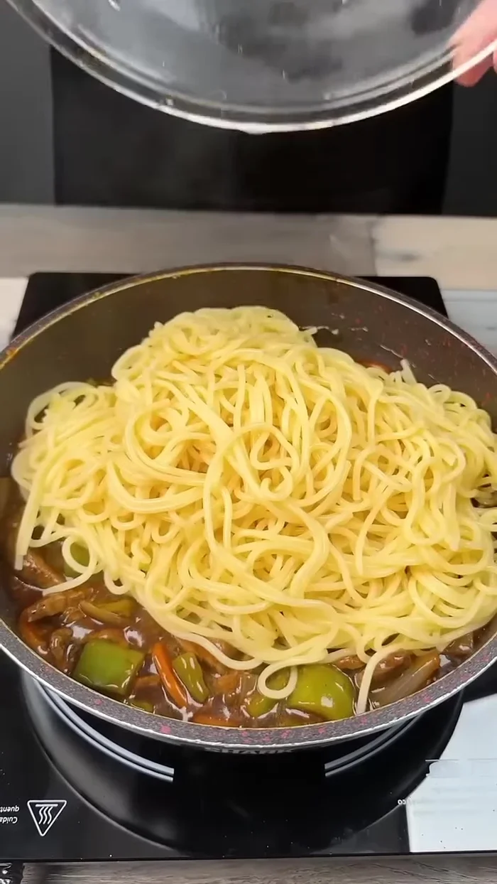 Drain the pasta and add it to the pot. Mix everything together.