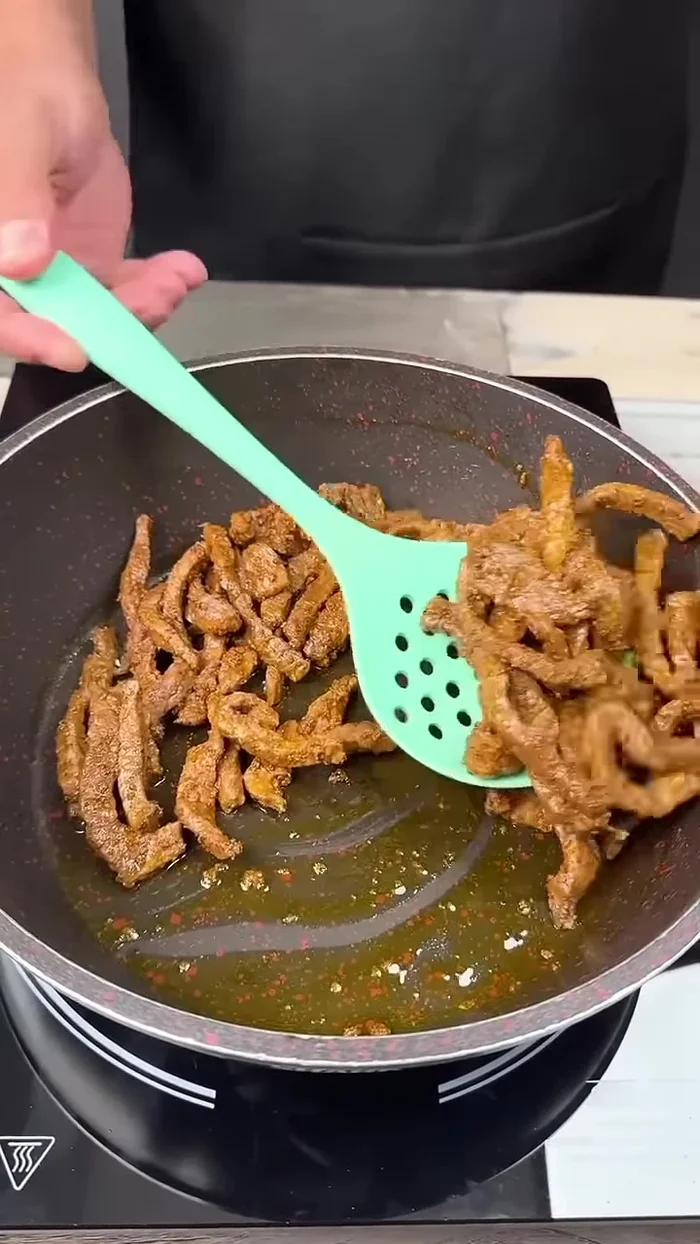 Remove the meat from the pan and set aside in a bowl.