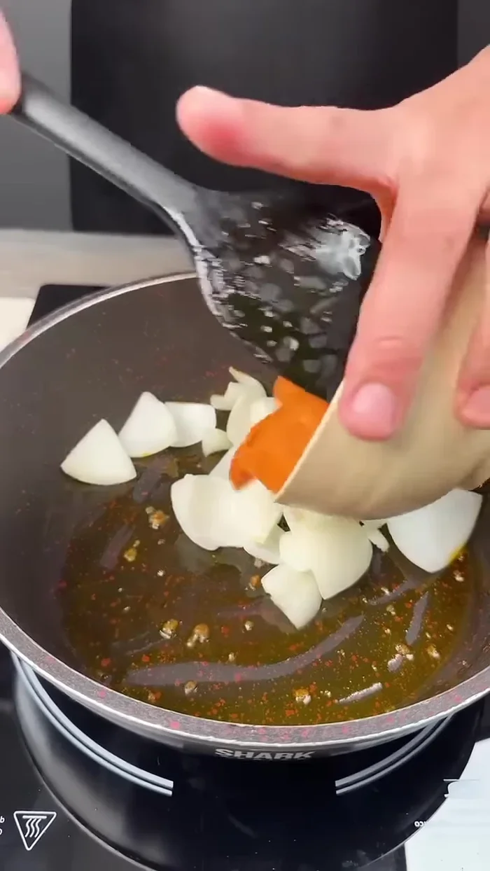 In the same pan, sauté 1 onion, 1 carrot, and 3 cloves of garlic.