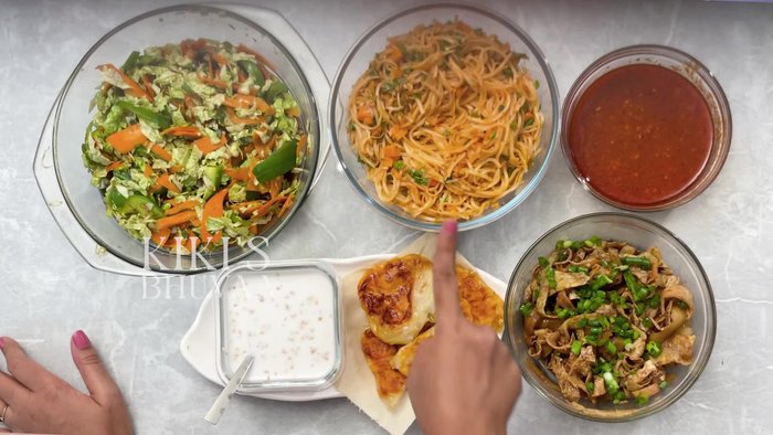 Prepare side dishes: Egg and cucumber gravy, mixed vegetable salad with soy sauce, deep-fried mango on rice paper.