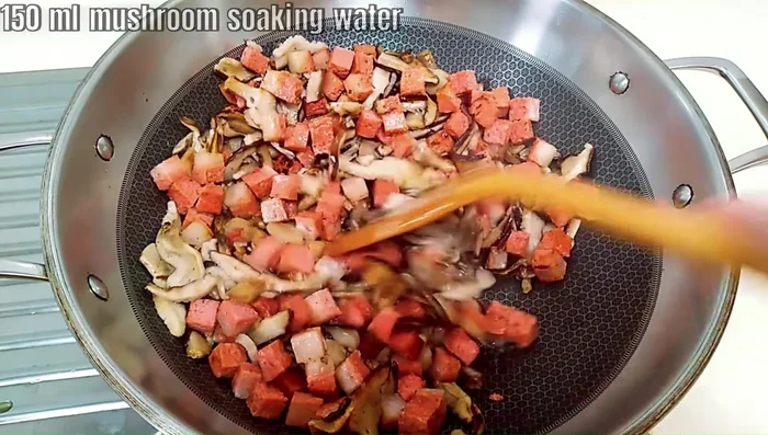 Add 150ml of mushroom soaking water to the filling, mixing until slightly moist.