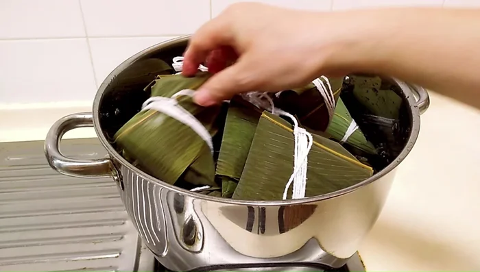 Bring a large pot of water to a boil. Add dumplings, ensuring they are fully submerged. Add salt to the water. Boil for 2 hours over medium heat, then let them sit in the hot water for another 30 minutes, adding hot water as needed.