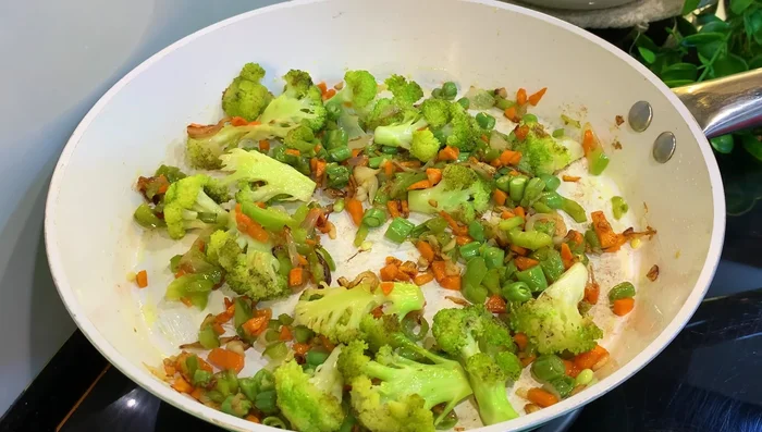 Add 3 cups of cooked rice (Basmati recommended, leftover rice is also fine).