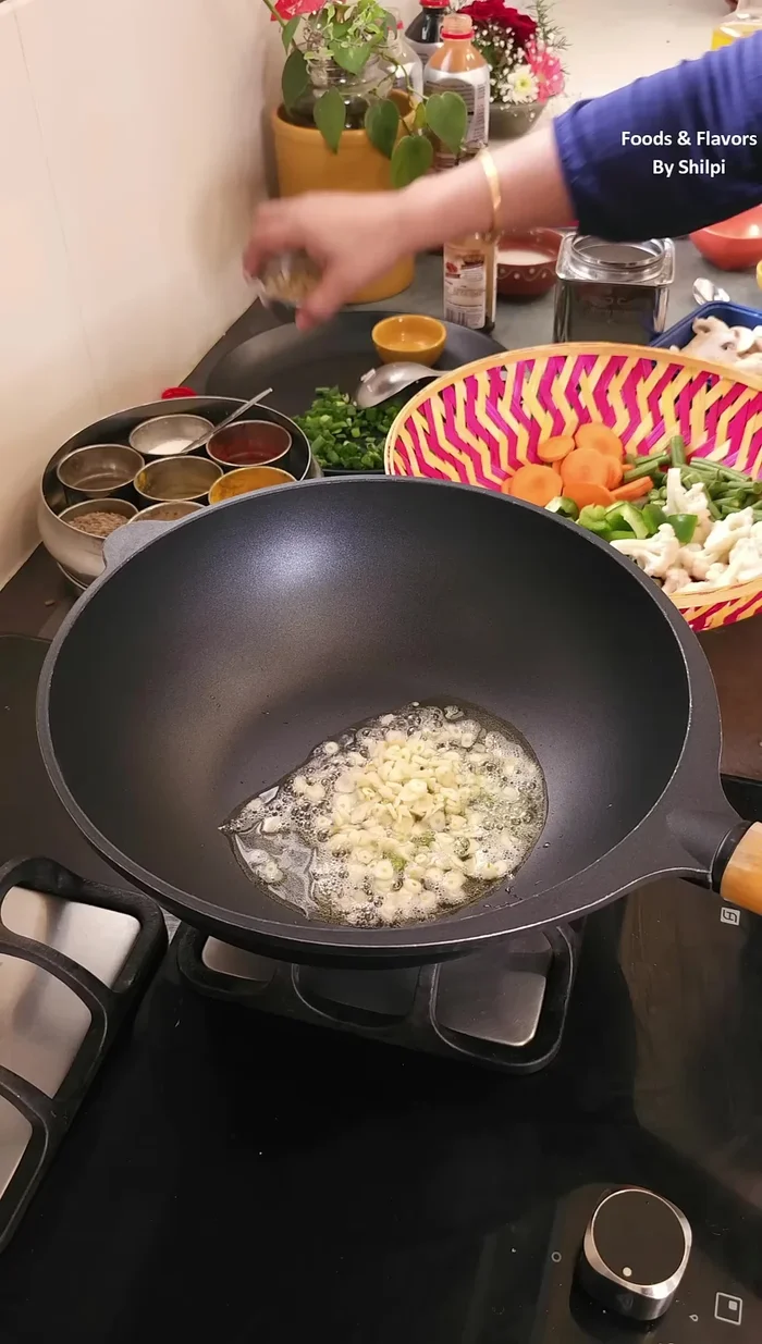Add chopped green chilies, garlic, and ginger; fry well (use a little more garlic).
