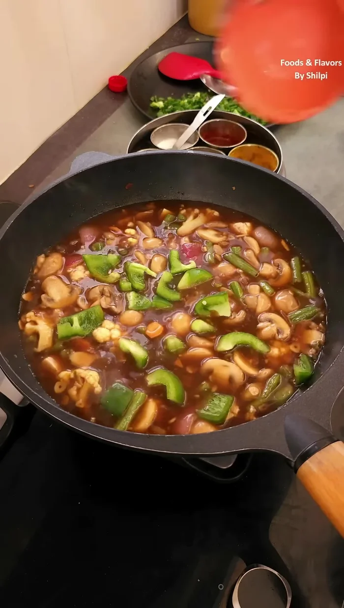 Add chopped capsicum, salt, vinegar, and a little sugar. Mix well.