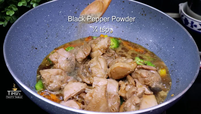 Combine and thicken: Return cooked chicken to the pan. Add black pepper, salt, cornstarch slurry, and Sriracha sauce. Mix well and cook for 2-3 minutes until gravy thickens.