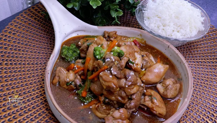 Garnish and serve: Garnish with coriander and sesame seeds. Serve hot with rice or noodles.
