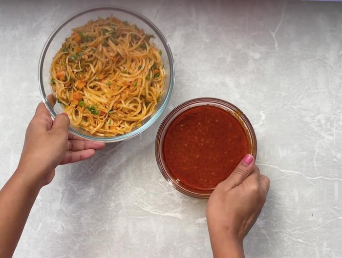 Serve Schezwan noodles, mango wontons, and salad together.