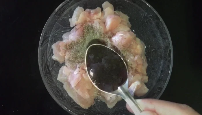 Marinate chicken with soy sauce, salt, pepper powder, ginger, and garlic. (The exact measurements are not specified in the transcript)