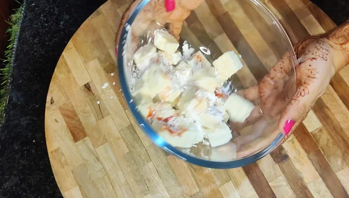 Mix paneer with salt, Kashmiri red chilli powder, and 1 tablespoon of corn starch. Gently coat the paneer, ensuring it doesn't break. Add more corn starch (1 tablespoon at a time) until lightly coated.