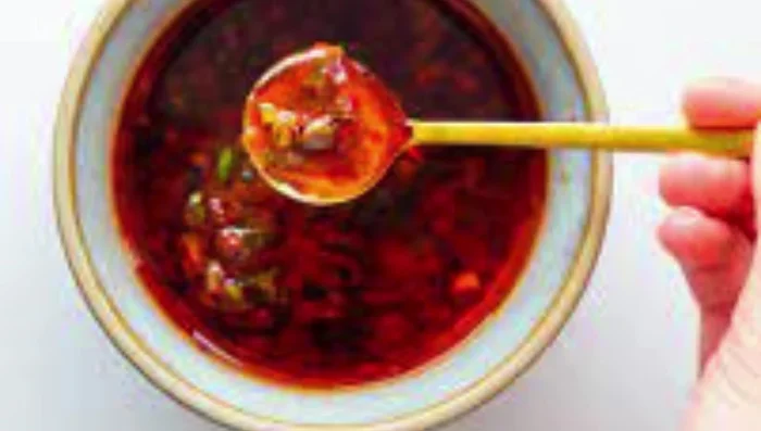 Once cooled, transfer the chili garlic oil to clean, sterilized jars for storage. This ensures it lasts longer and stays fresh.